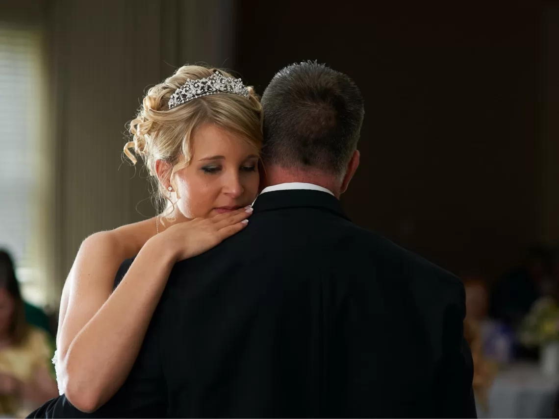 A father and daughter dancing at a wedding.