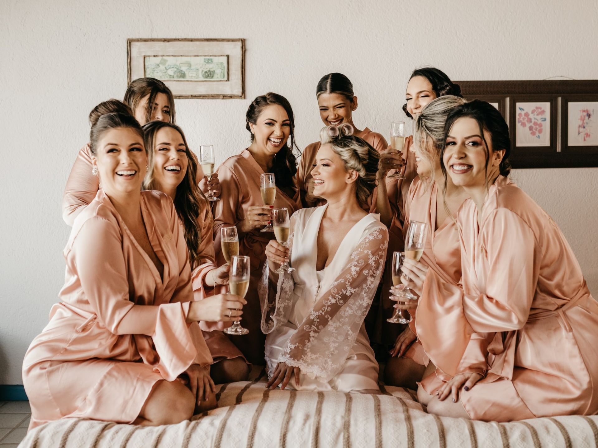 A bride and bridesmaids getting ready together.