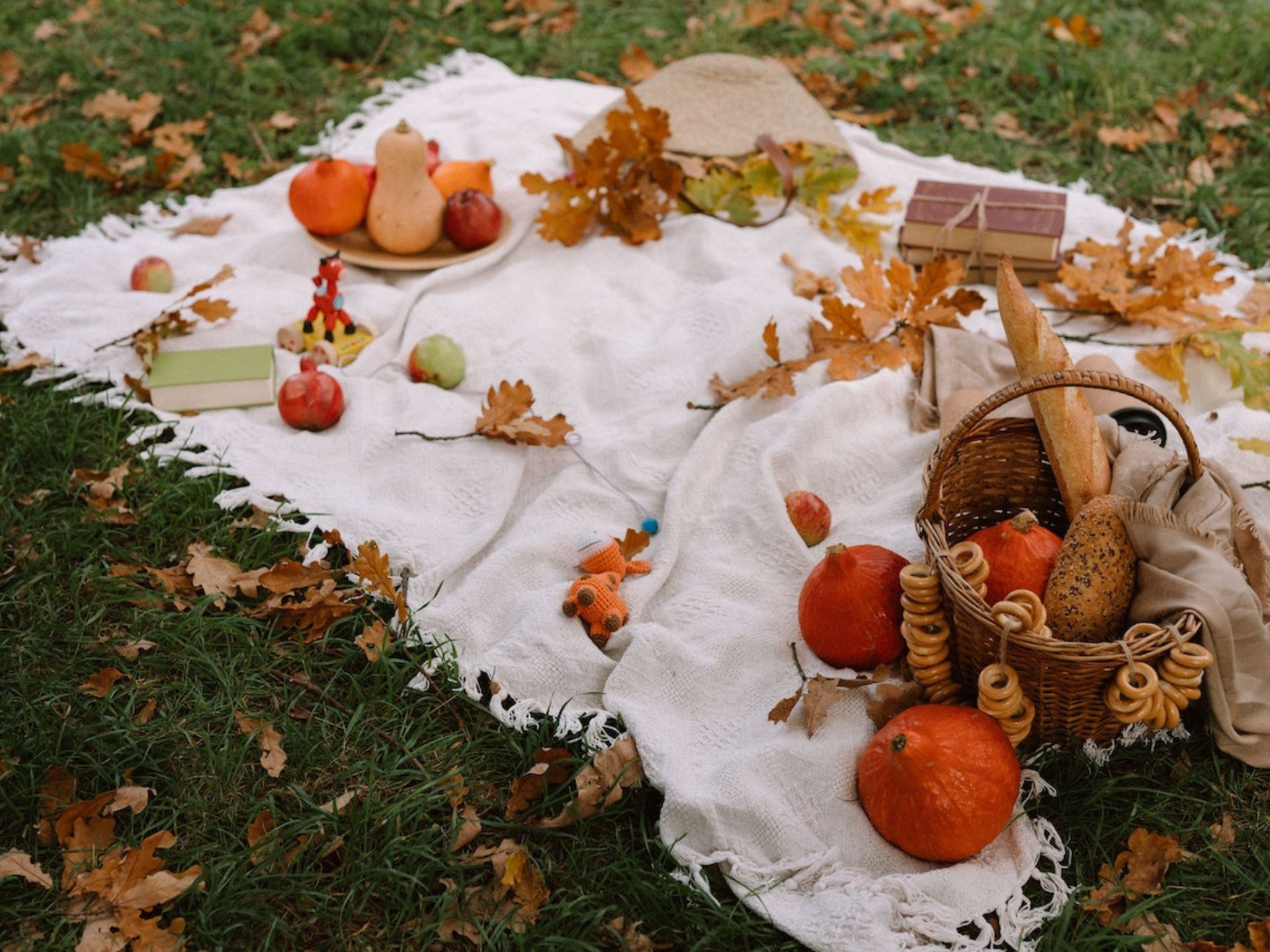 A photo of a couple having a picnic with text over the photo that says halloween date ideas for couples.
