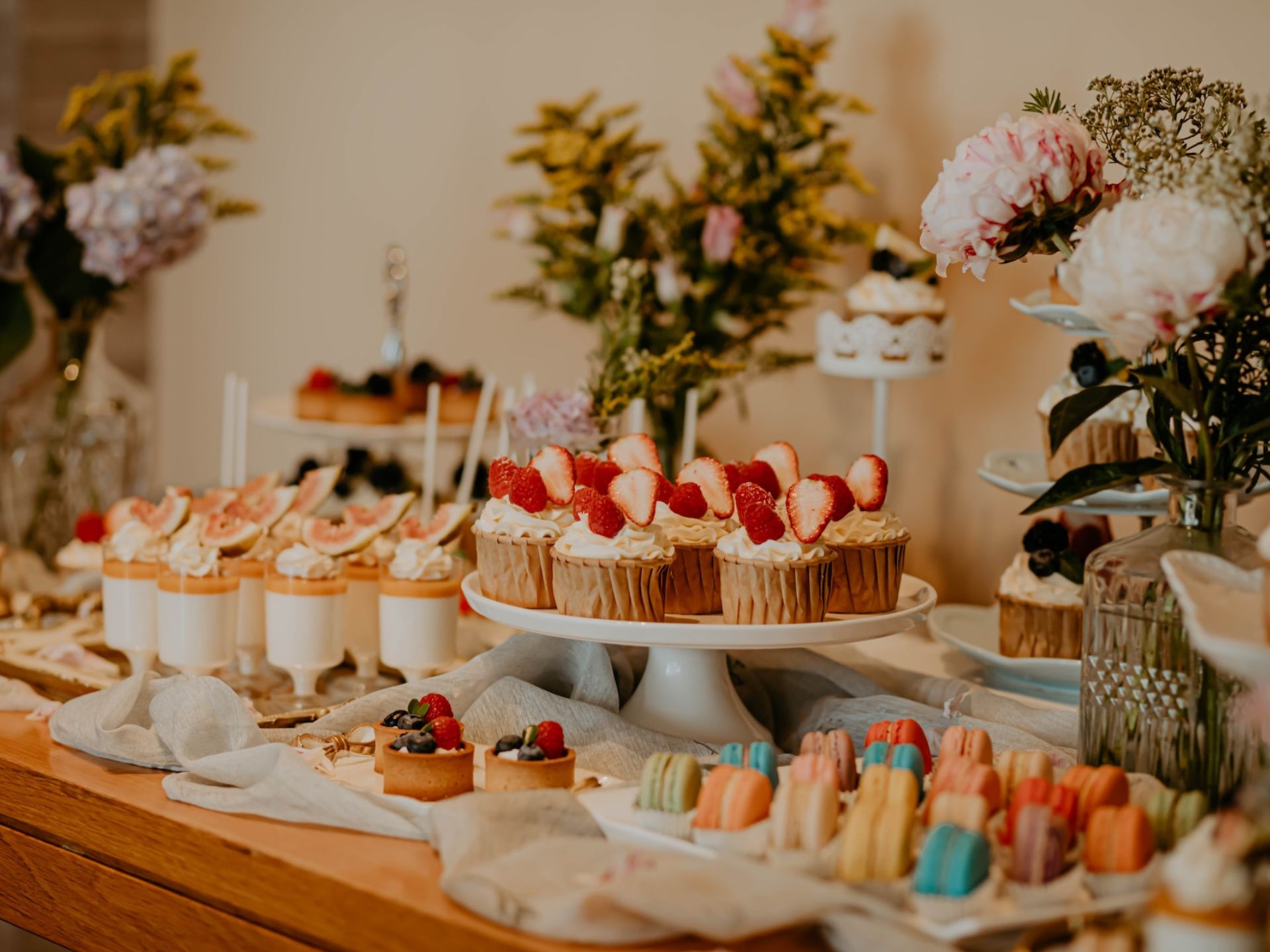 A wedding table filled with desserts.