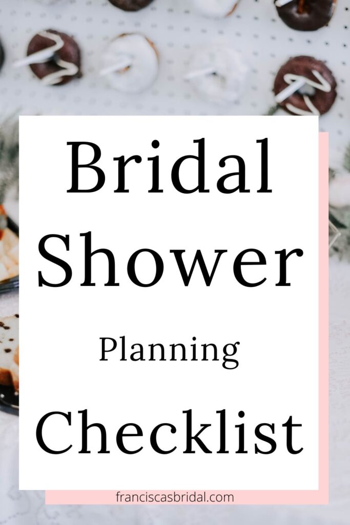 A table filled with party finger food with text over the photo that says bridal shower planning checklist.
