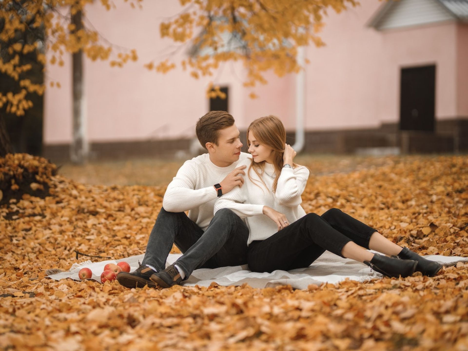 A couple having a fall picnic.