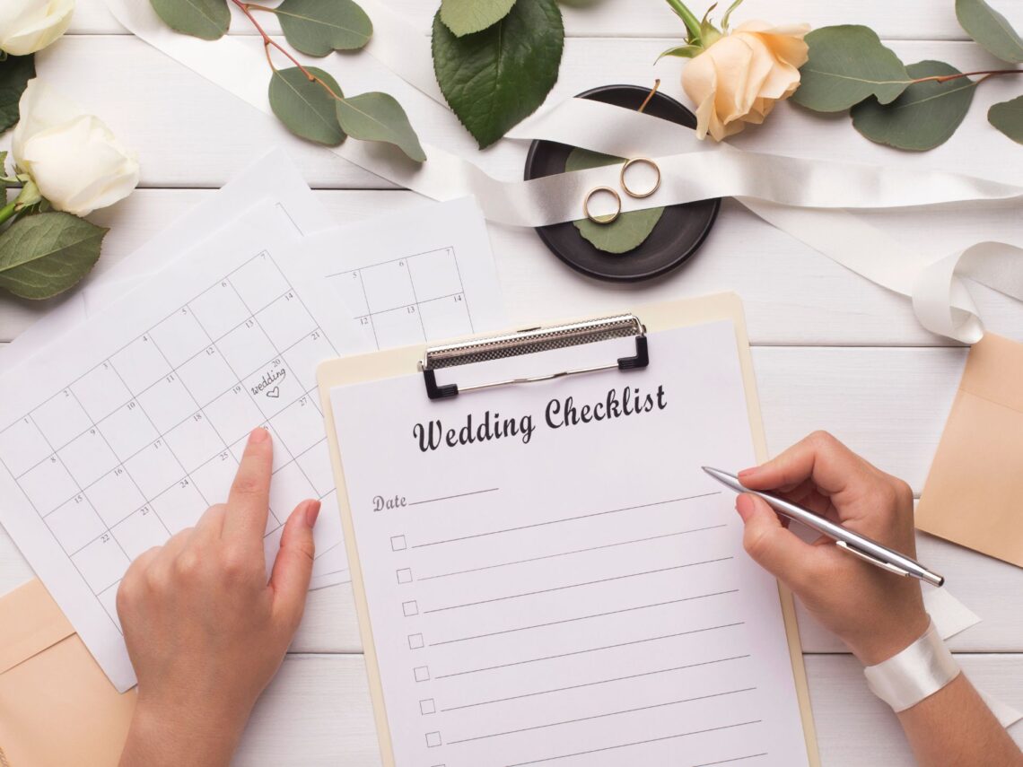 A bride writing down a checklist.