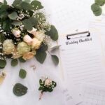 A desk filled with wedding planning papers.