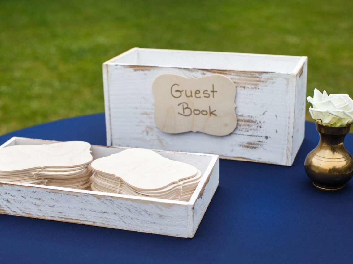 A wedding table with a guestbook on top.