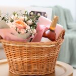 A wedding gift basket filled with champagne and flowers.