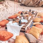A fall themed picnic bachelorette party on the beach.