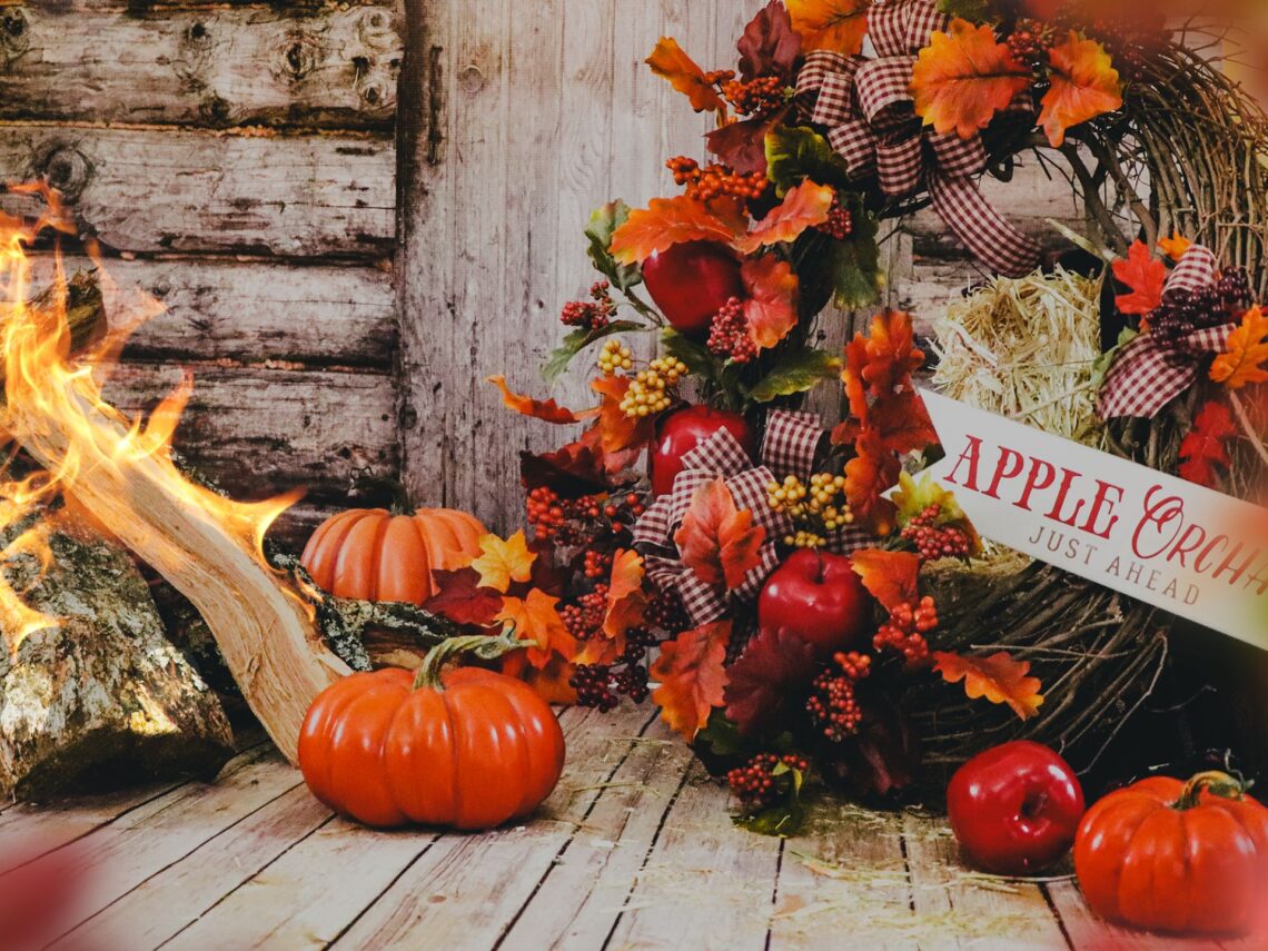 A front porch decorated for fall.