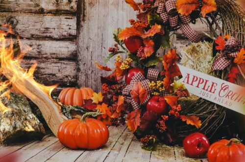 A front porch decorated for fall.