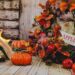 A front porch decorated for fall.