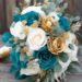 A teal blue and gold colored wedding bouquet.