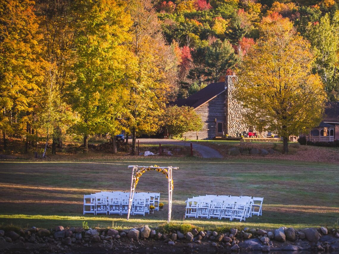 An outdoor fall wedding near a lake.