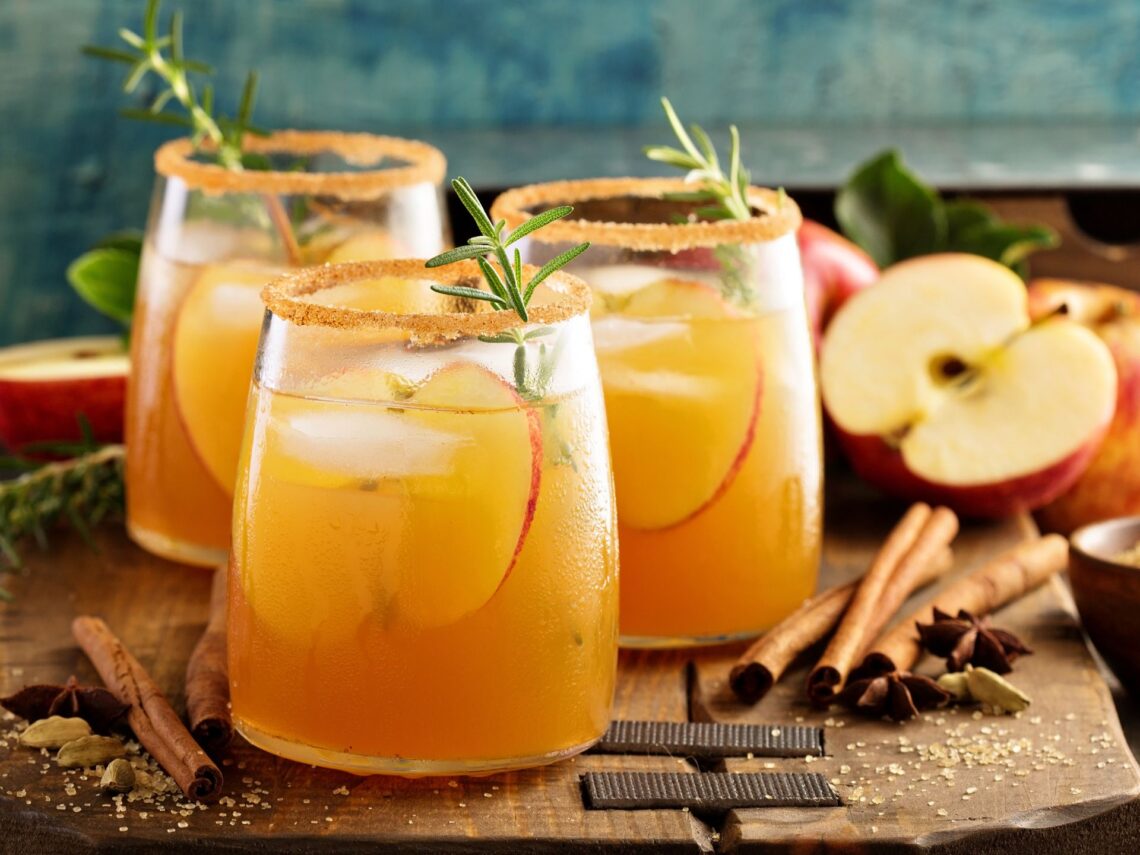 A tray with 3 hard apple cider cocktails.