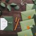 A table with green wedding invitations and save the date cards.