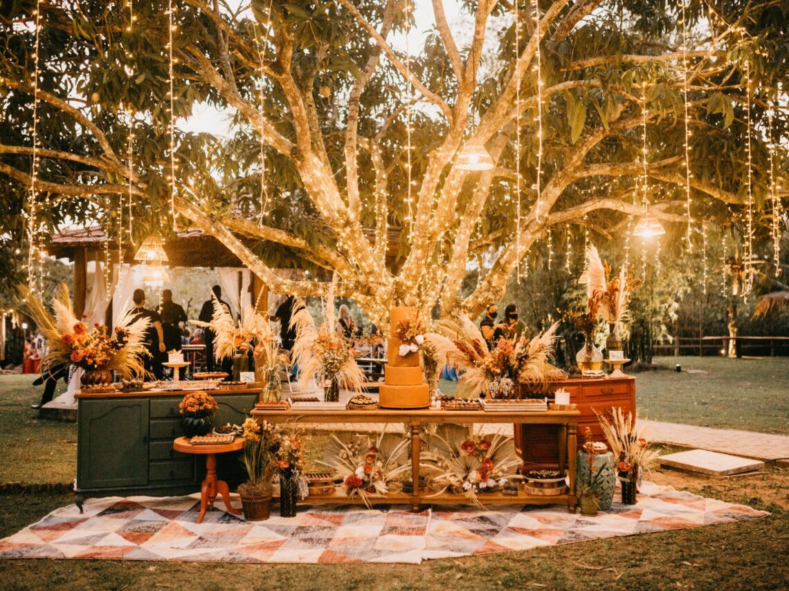 An outdoor wedding reception with string lights.