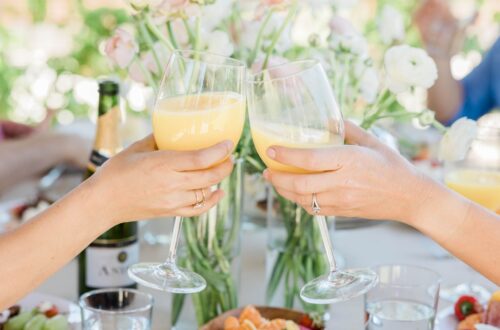 Bridesmaids drinking mimosas at a brunch party.