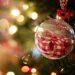 A christmas tree with red christmas ornaments.