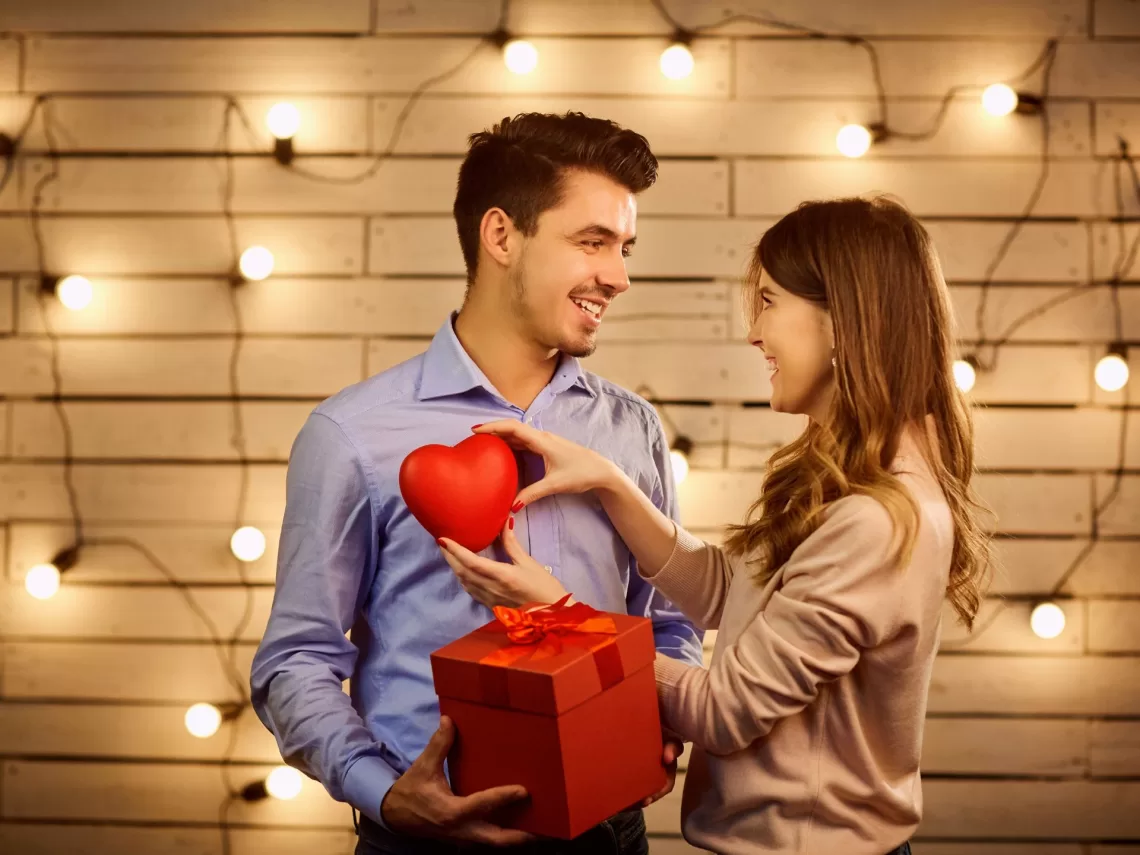 A couple exchanging valentine's day gifts.